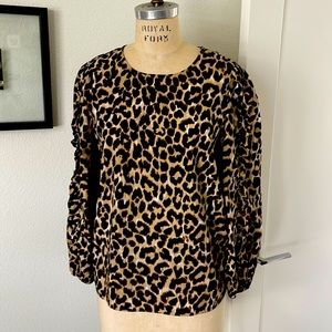 80’s vibe leopard blouse with puffy sleeves with ruffles.
